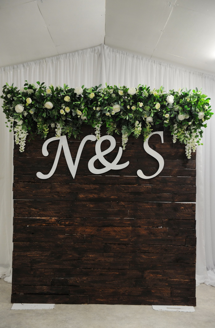 timber floral backdrop with letters intials