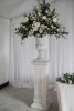 floral display with stone plinth